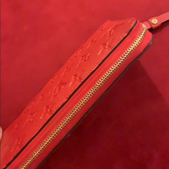 LV red leather Empreinte zippy wallet